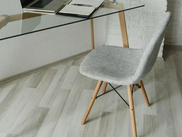 luxury vinyl floors in office with a glass desk